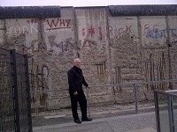 Breckenhill's William (Bill) Wilson in front of a remaining section of the "Wall" in Berlin